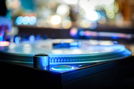 DJ vinyl players in dark nightclub, party in the dance club, DJ equipment, defocused の写真素材