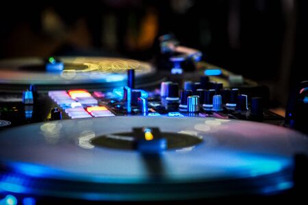 DJ vinyl players in dark nightclub, party in the dance clubの写真素材