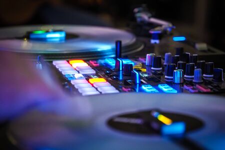 DJ vinyl players in dark nightclub, party in the dance clubの写真素材