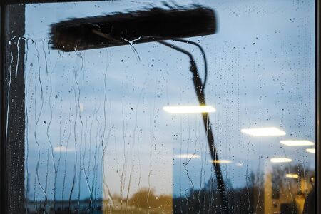 Window cleaning using telescopic water brush and wash system. Commercial window cleaning from the...