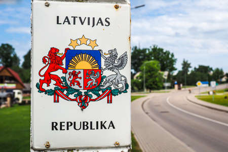 Skaistkalne, Latvia â June 12, 2020: Latvian border crossing with Lithuanian and Coat of arms of Republic of Latviaのeditorial素材