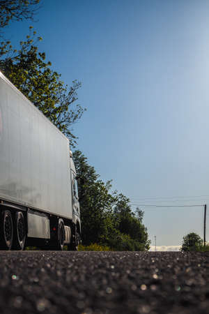 Large truck on the highway, cargo transportation, vertical photoの写真素材