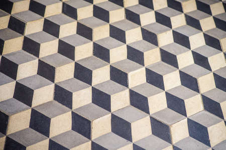 3D square tiles on the floor, cube shapes. Optical illusion. Vintage tiles