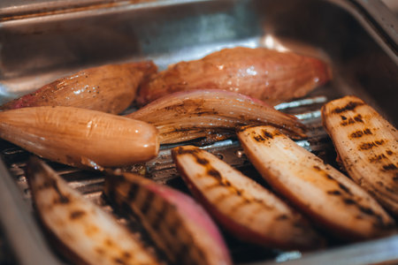 Shallot onions cooked on a grill pan. Defocusedの写真素材