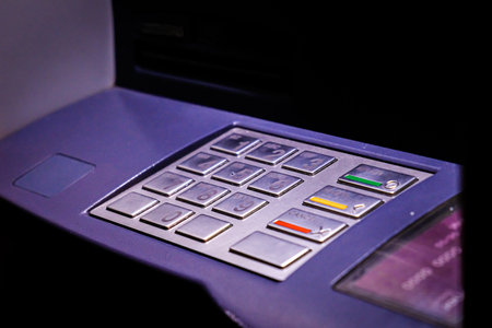 ATM Bank cash machine in the night, keyboard close-up. Selective focusの写真素材