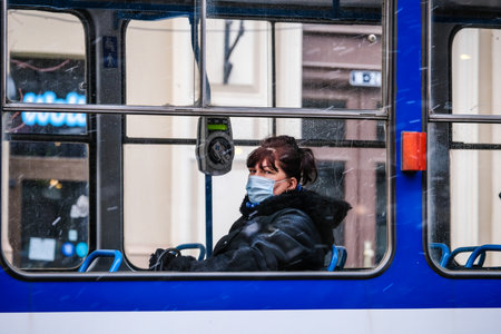 Lined up public electric scooters for rent in the city. Electric scooter transportation. Electric scooters steering wheels.のeditorial素材