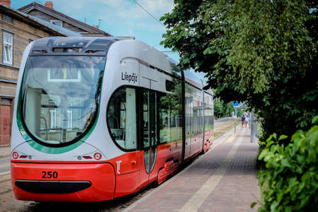 Liepaja, LATVIA - June 22, 2021: New tram on streets of Liepaja, Latviaのeditorial素材