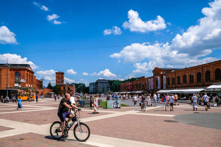 LODZ, POLAND - June 27, 2021: Inner square of Manufaktura, an arts centre, shopping mall, and leisure complex in Lodz, Poland. Defocusedのeditorial素材