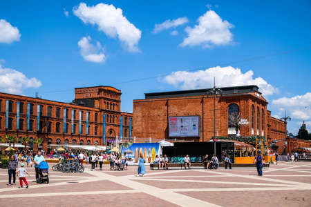 LODZ, POLAND - June 27, 2021: Inner square of Manufaktura, an arts centre, shopping mall, and leisure complex in Lodz, Poland. Defocusedのeditorial素材