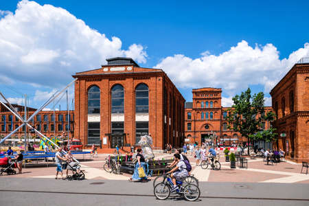 LODZ, POLAND - June 27, 2021: Inner square of Manufaktura, an arts centre, shopping mall, and leisure complex in Lodz, Poland. Defocusedのeditorial素材