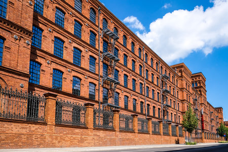 LODZ, POLAND - June 27, 2021: Inner square of Manufaktura, an arts centre, shopping mall, and leisure complex in Lodz, Poland. Defocusedのeditorial素材