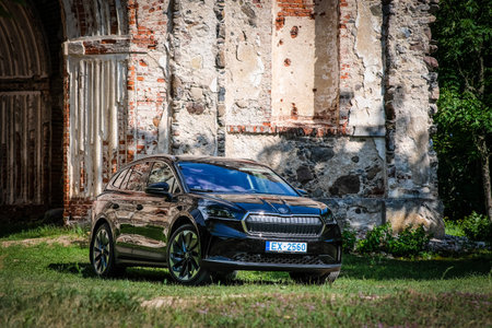 Madona, Latvia - July 20, 2021: New Skoda Enyaq IV, a SUV electric car. Defocusedのeditorial素材