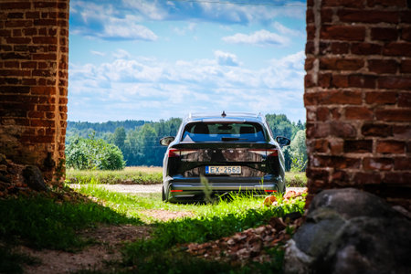 Madona, Latvia - July 20, 2021: New Skoda Enyaq IV, a SUV electric car. Defocusedのeditorial素材