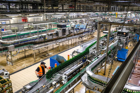 Pilsen, Czech Republic - September 17, 2021: Beer brewery Pilsner Urquell Brewery bottling plant in Plzen, Czech Republic. Defocusedのeditorial素材