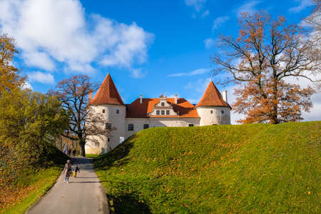 Bauska, Latvia - October 23, 2021: Historic Bauska castle in Latvia up in the hill in sunny autumn day. Selective focusのeditorial素材