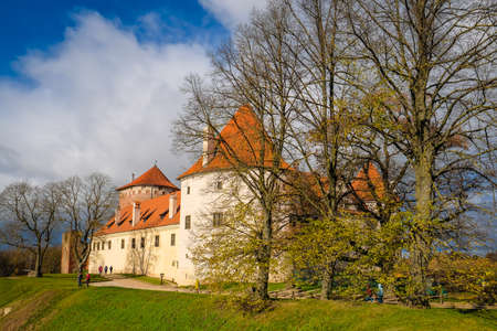 Bauska, Latvia - October 23, 2021: Historic Bauska castle in Latvia up in the hill in sunny autumn day. Selective focusのeditorial素材