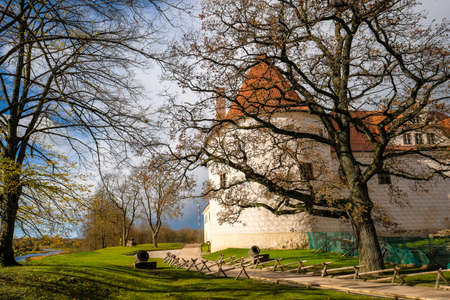 Bauska, Latvia - October 23, 2021: Historic Bauska castle in Latvia up in the hill in sunny autumn day. Selective focusのeditorial素材