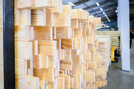 A large pile of wooden boards stored in a sawmill. Selective focusの写真素材