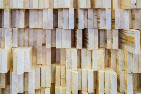 A large pile of wooden boards stored in a sawmill. Selective focusの写真素材