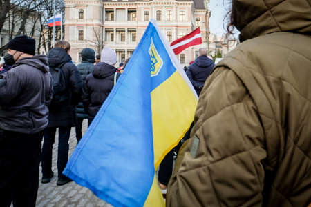 Riga, Latvia - February 24, 2022: Protest against the Russian invasion in Ukraine at the Russian Embassy in Riga, Latvia. Selective focusのeditorial素材