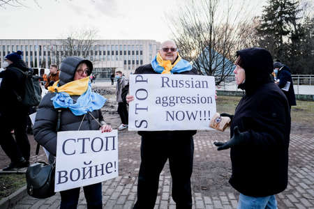 Riga, Latvia - February 24, 2022: Protest against the Russian invasion in Ukraine at the Russian Embassy in Riga, Latvia. Selective focusのeditorial素材