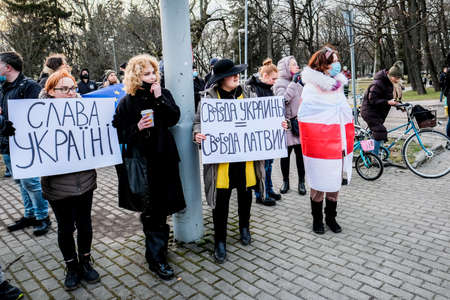 Riga, Latvia - February 24, 2022: Protest against the Russian invasion in Ukraine at the Russian Embassy in Riga, Latvia. Selective focusのeditorial素材