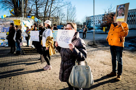 Riga, Latvia - February 28, 2022: Protest against the Russian invasion in Ukraine at the Russian Embassy in Riga, Latvia. Defocusedのeditorial素材