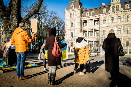 Riga, Latvia - February 28, 2022: Protest against the Russian invasion in Ukraine at the Russian Embassy in Riga, Latvia. Defocusedのeditorial素材
