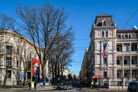 Riga, Latvia - March 9, 2022: A poster of Russian President Vladimir Putin appeared on the building of the Museum of Medical History. The museum is located directly in front of the Russian embassy.のeditorial素材