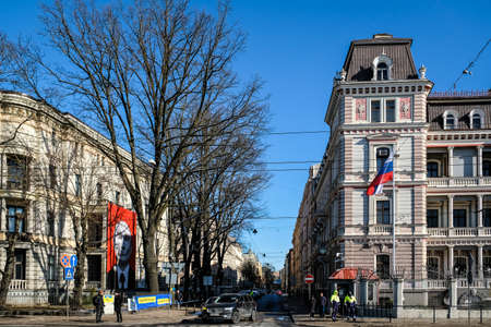 Riga, Latvia - March 9, 2022: A poster of Russian President Vladimir Putin appeared on the building of the Museum of Medical History. The museum is located directly in front of the Russian embassy.のeditorial素材