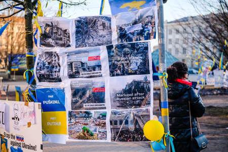 Riga, Latvia - March 15, 2022: Protest against the Russian invasion in Ukraine at the Russian Embassy in Riga, Latvia. Defocusedのeditorial素材