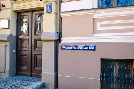 Riga, Latvia - March 30 2022: Street sign with the inscription Ukrainian Independence Street in the center of Riga. The street on which the Russian Embassy is located was renamed in Rigaのeditorial素材