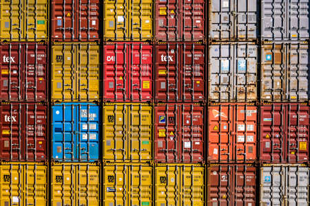 Riga, Latvia - April 20, 2022: Stack of shipping containers in a harbor. High quality photoのeditorial素材