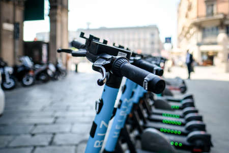 Milan, Italy - April 14, 2022: Helbiz rental scooters in Milan