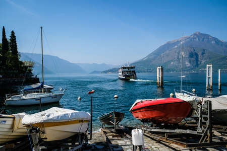 Varenna, Italy - April 15, 2022: Como Lake and town of Varenna waterfront, Lombardy region of Italyのeditorial素材