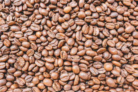 Roasted coffee beans background tinted. Textureの写真素材