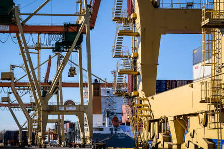 Riga, Latvia - April 20, 2022: Baltic Container Terminal in Freeport of Riga. Riga harbour, Latvia. Container ships in a portのeditorial素材
