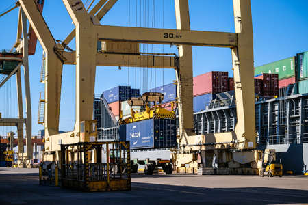 Riga, Latvia - April 20, 2022: Baltic Container Terminal in Freeport of Riga. Riga harbour, Latvia. Container ships in a portのeditorial素材