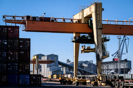 Riga, Latvia - April 20, 2022: Baltic Container Terminal in Freeport of Riga. Riga harbour, Latvia. Container ships in a port. Defocusedのeditorial素材
