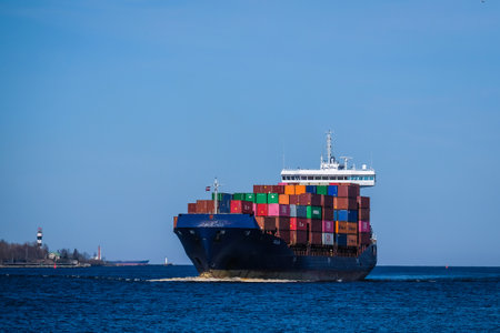 Riga, Latvia - April 20, 2022: Baltic Container Terminal in Freeport of Riga. Riga harbour, Latvia. Container ships in a port. Defocusedのeditorial素材