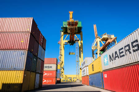 Riga, Latvia - April 20, 2022: Baltic Container Terminal in Freeport of Riga. Riga harbour, Latvia. Container ships in a port. Defocusedのeditorial素材