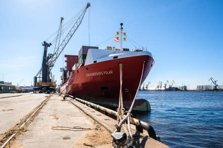 Riga, Latvia - April 20, 2022: Baltic Container Terminal in Freeport of Riga. Riga harbour, Latvia. Container ships in a port. Defocusedのeditorial素材
