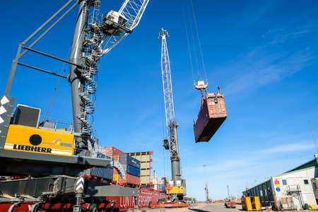 Riga, Latvia - April 20, 2022: Baltic Container Terminal in Freeport of Riga. Riga harbour, Latvia. Container ships in a port. Defocusedのeditorial素材