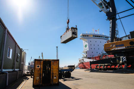 Riga, Latvia - April 20, 2022: Baltic Container Terminal in Freeport of Riga. Riga harbour, Latvia. Container ships in a port. Defocusedのeditorial素材
