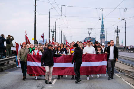 Riga, Latvia - May 20, 2022: Latvian protests agains Soviet legacy and Victory Memorial monument to...