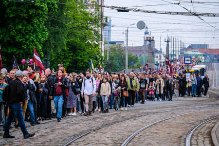 Riga, Latvia - May 20, 2022: Latvian protests agains Soviet legacy and Victory Memorial monument to Soviet Army in Riga which is to be demolished. Selective focus.のeditorial素材
