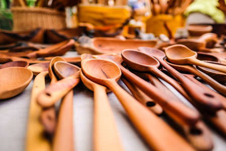 Craftsman made wooden spoons at the fair, selective focus