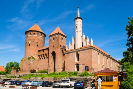 Reszel, Poland - June 12, 2022: Castle and the Church of the Holy Apostles Peter and Paul in historic town Reszel, Polandのeditorial素材