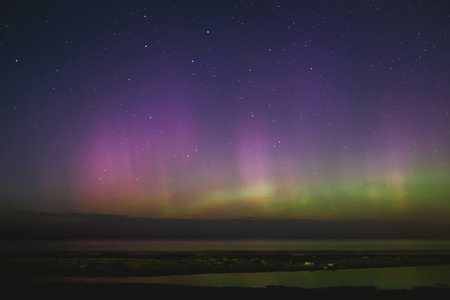 Intense northern lights aurora borealis over beach in Riga, Latvia. Defocusedの写真素材