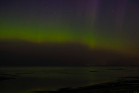 Intense northern lights aurora borealis over beach in Riga, Latvia. Defocusedの写真素材
